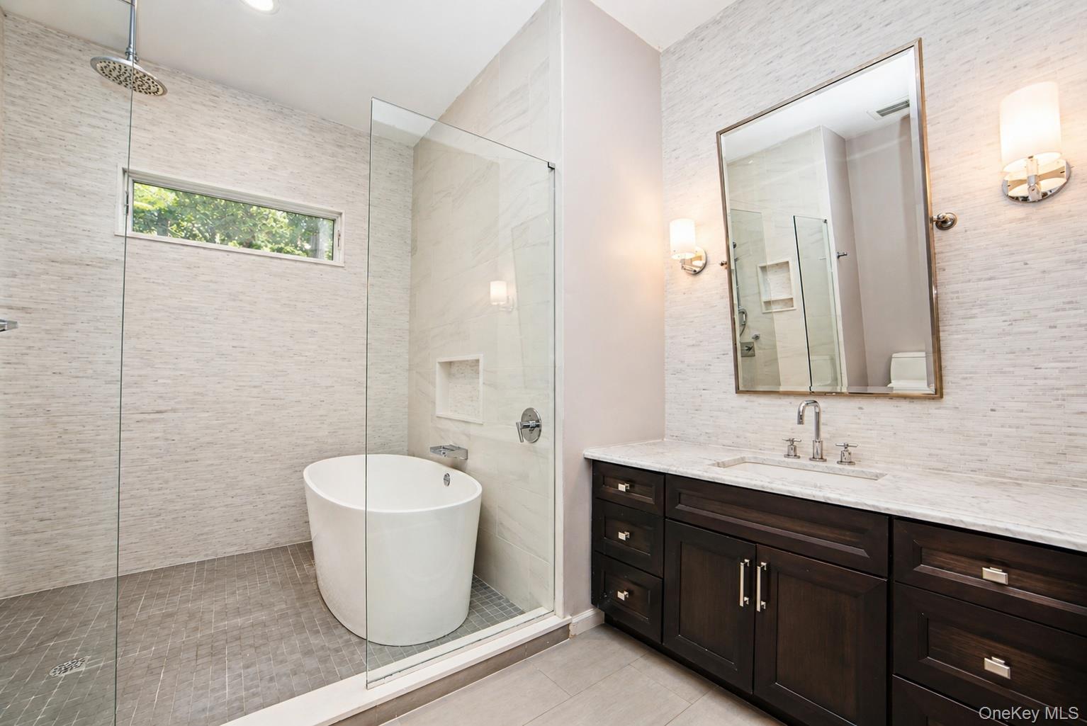 704 Short Beach Road Nissequogue, NY 11780 - Photo 12 of 25 a bathroom with a sink toilet a mirror and shower