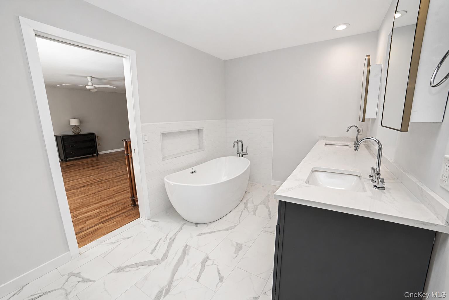 704 Short Beach Road Nissequogue, NY 11780 - Photo 18 of 25 a bathroom with a sink and a mirror
