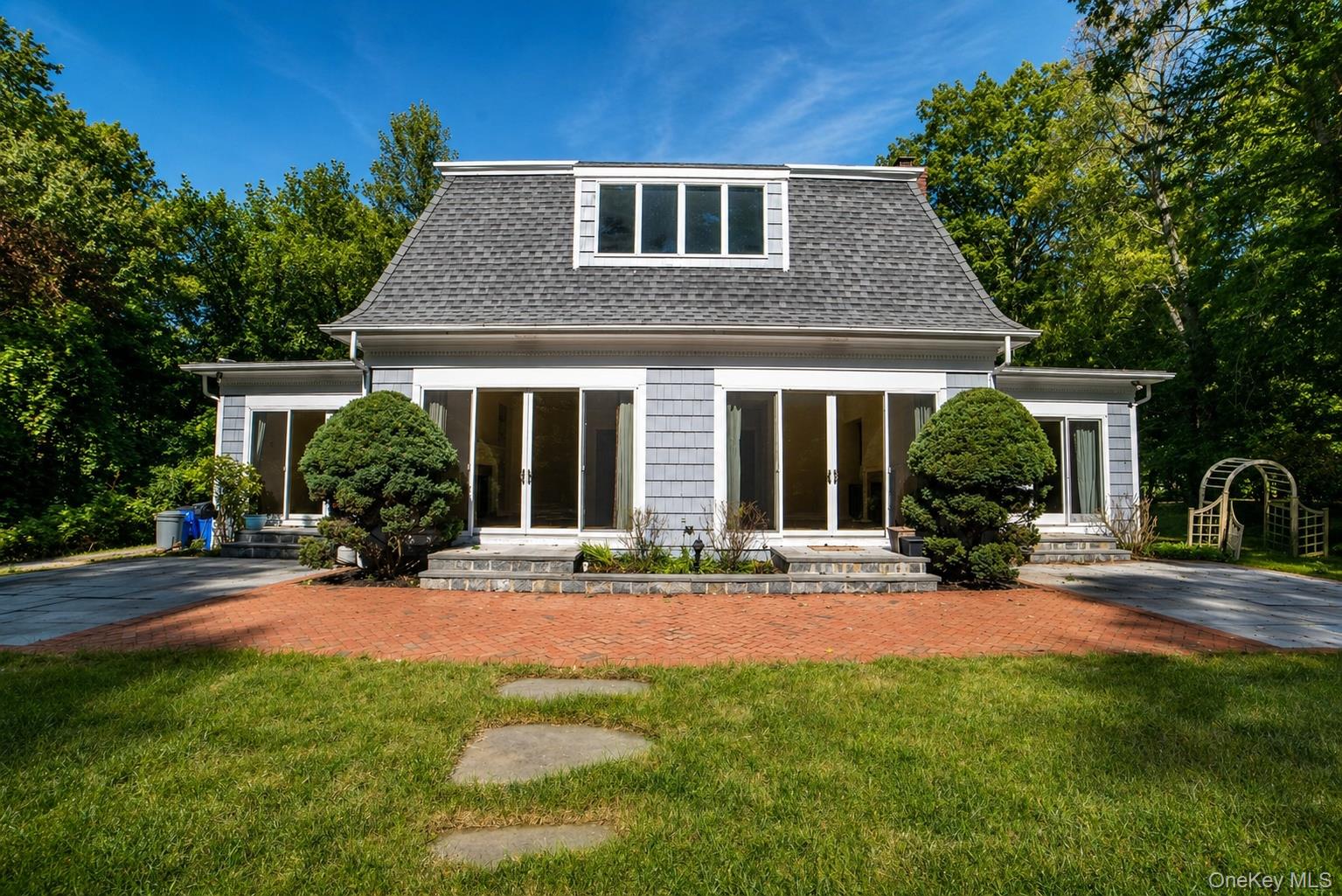 704 Short Beach Road Nissequogue, NY 11780 - Photo 19 of 25 a front view of a house with yard and porch