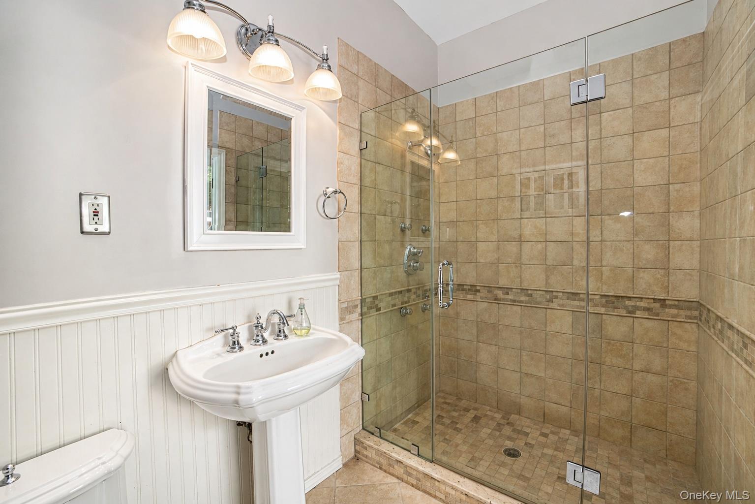 704 Short Beach Road Nissequogue, NY 11780 - Photo 23 of 25 a bathroom with a sink shower and a mirror