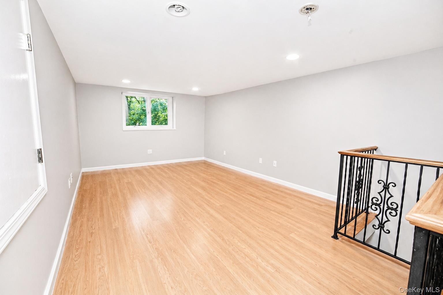 704 Short Beach Road Nissequogue, NY 11780 - Photo 25 of 25 a view of empty room with wooden floor and fan