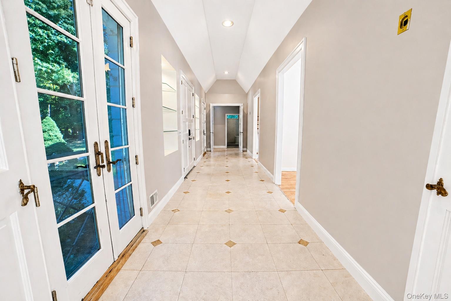 704 Short Beach Road Nissequogue, NY 11780 - Photo 4 of 25 a view of a hallway with wooden floor and staircase