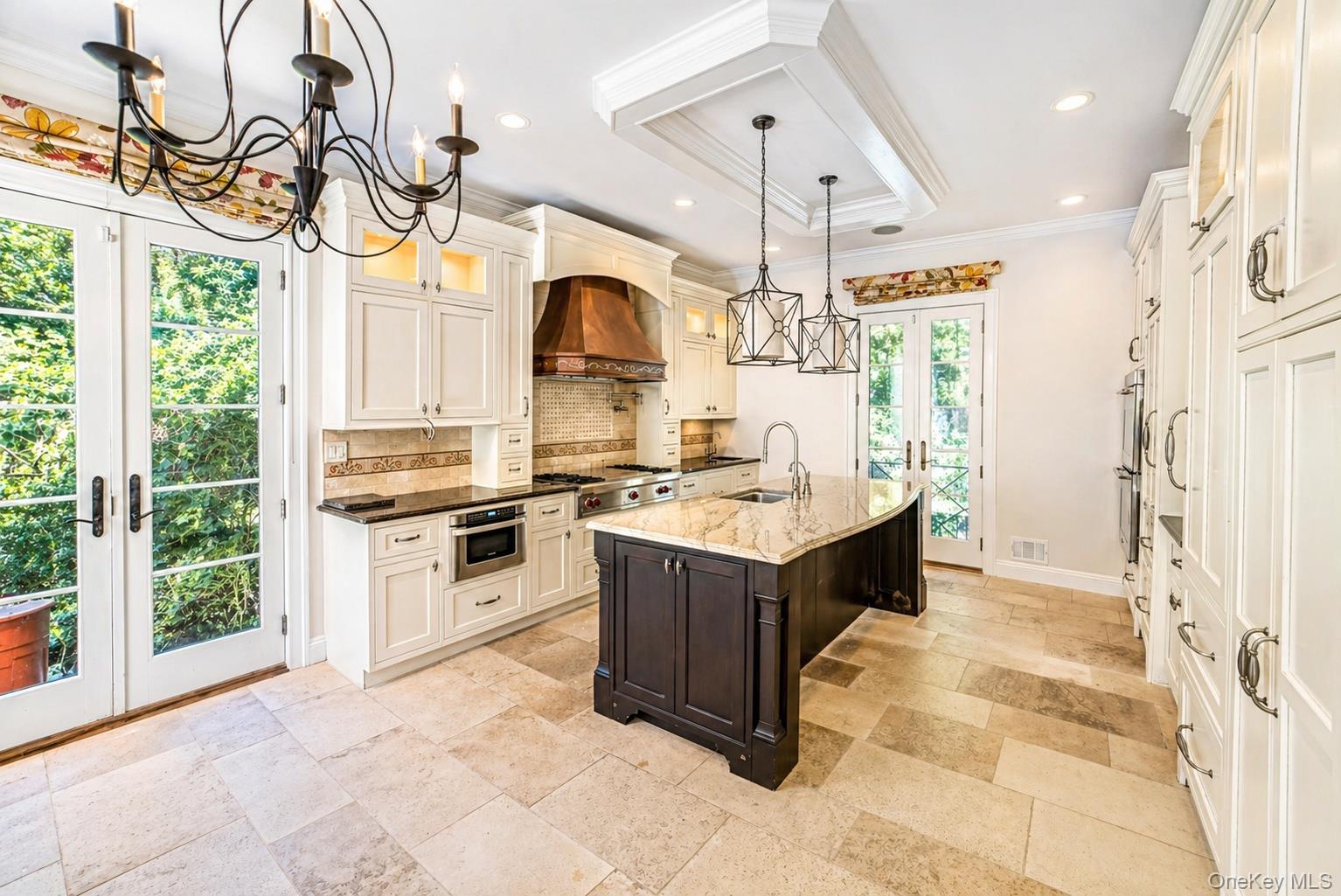704 Short Beach Road Nissequogue, NY 11780 - Photo 5 of 25 a kitchen with a sink cabinets and window