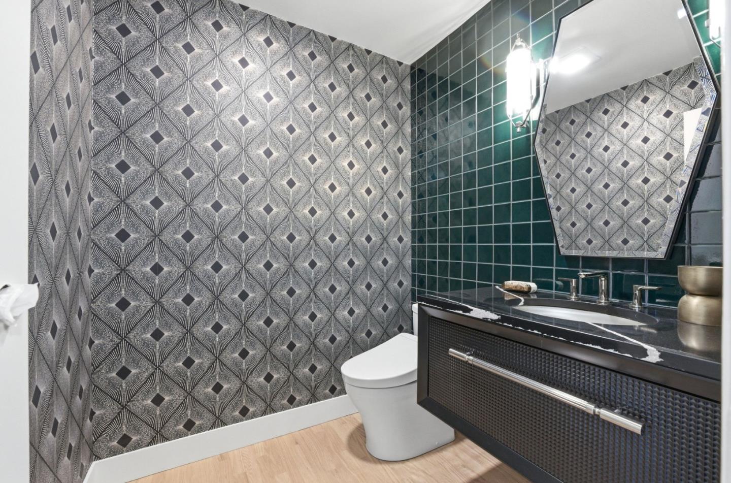 1003 Rosa Avenue Sunnyvale, CA 94086 - Photo 23 of 60 a bathroom with a sink a toilet and a mirror