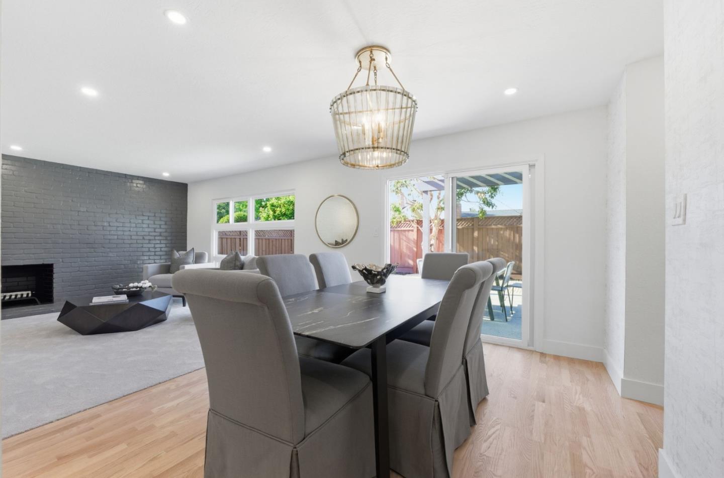 1003 Rosa Avenue Sunnyvale, CA 94086 - Photo 24 of 60 a view of a dining room with furniture wooden floor and chandelier