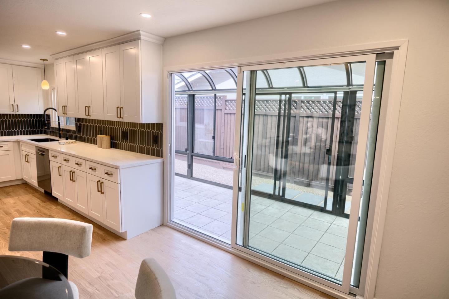 1003 Rosa Avenue Sunnyvale, CA 94086 - Photo 28 of 60 a kitchen with stainless steel appliances granite countertop a stove and a refrigerator