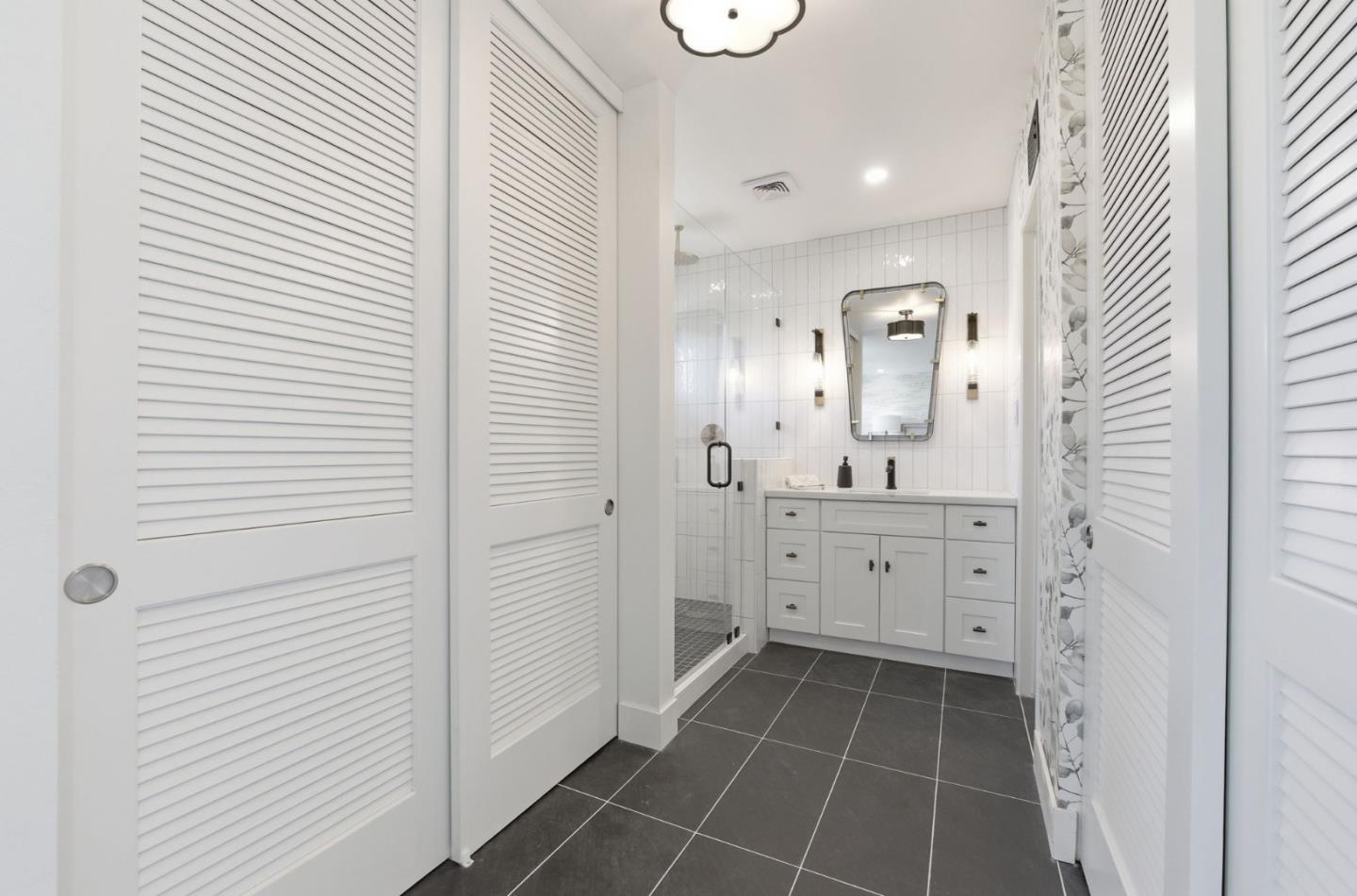 1003 Rosa Avenue Sunnyvale, CA 94086 - Photo 39 of 60 a spacious bathroom with a double vanity sink a mirror and a shower