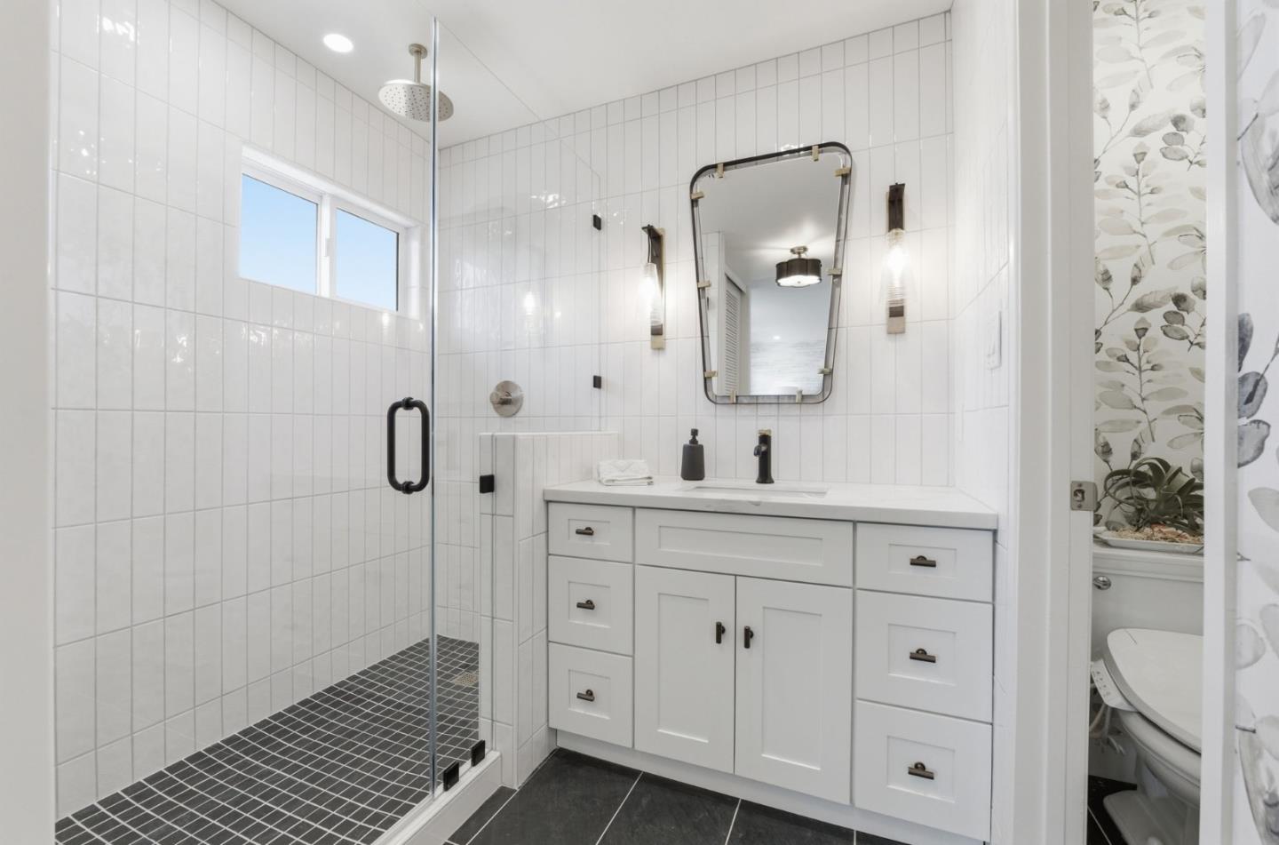 1003 Rosa Avenue Sunnyvale, CA 94086 - Photo 40 of 60 a bathroom with a double vanity sink mirror and shower