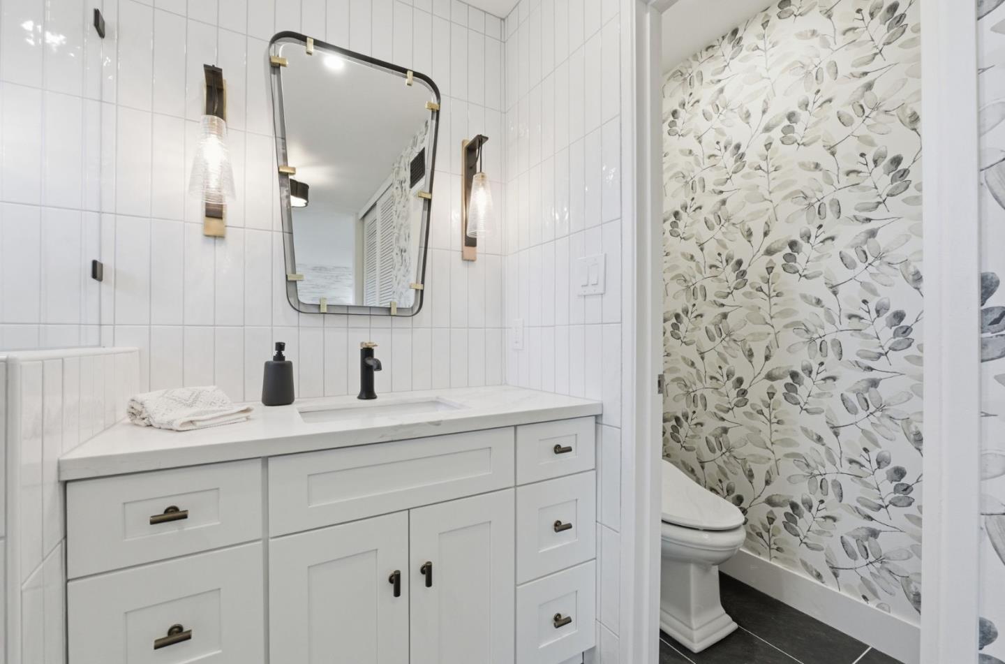 1003 Rosa Avenue Sunnyvale, CA 94086 - Photo 41 of 60 a bathroom with a sink toilet and shower