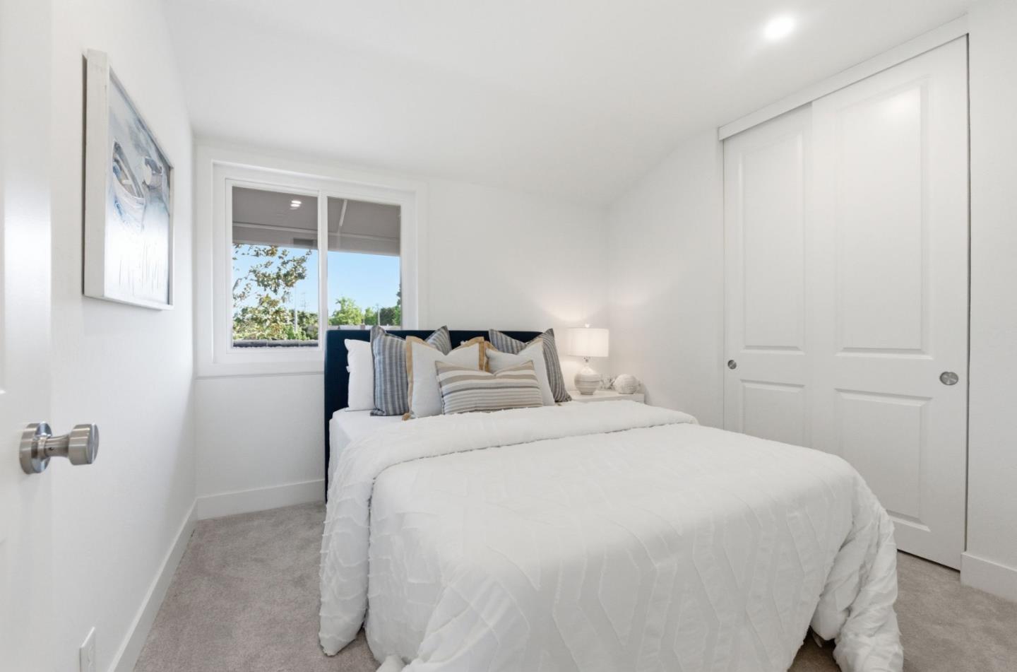 1003 Rosa Avenue Sunnyvale, CA 94086 - Photo 42 of 60 a bedroom with a bed and a painting on the wall