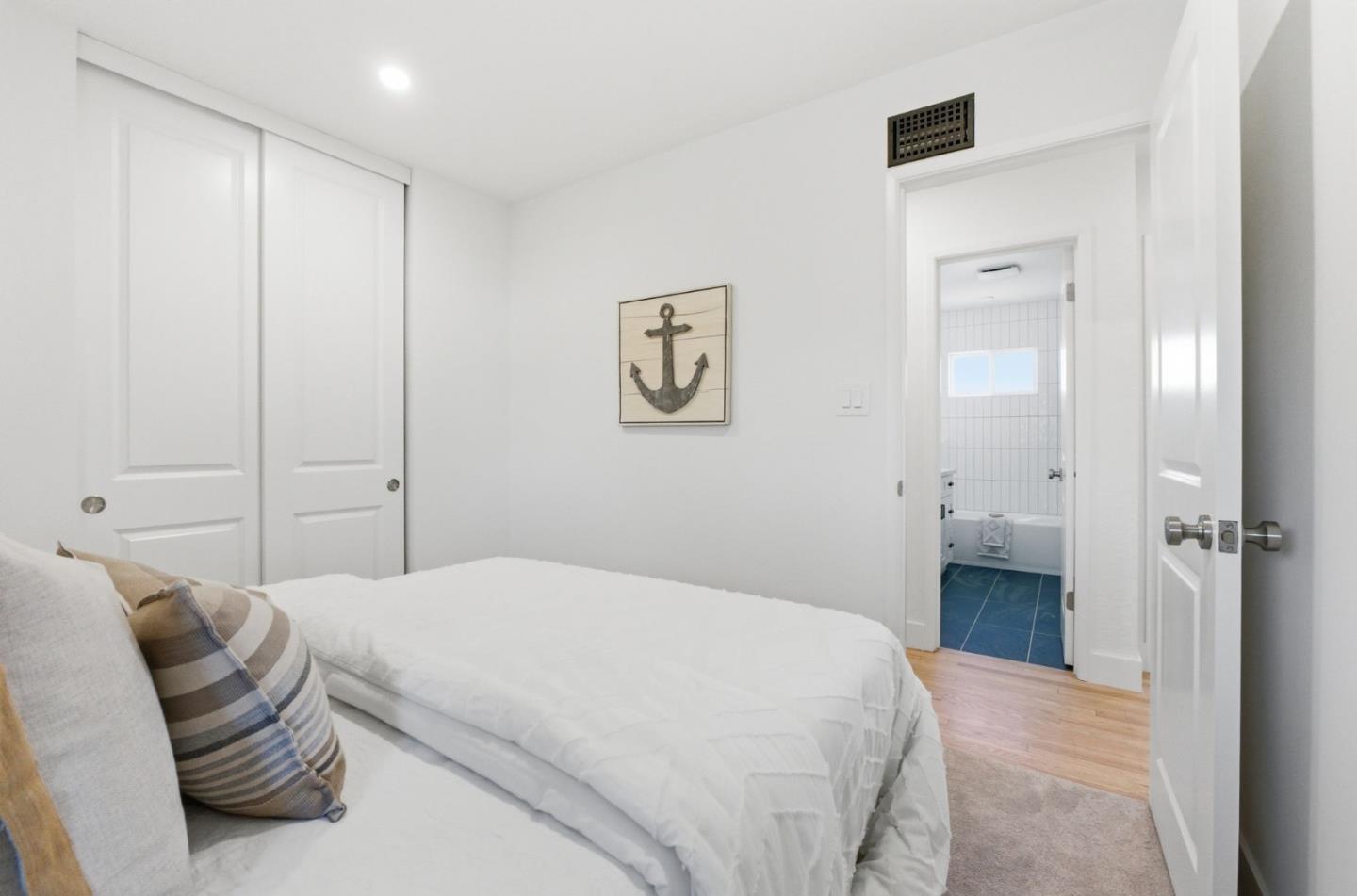 1003 Rosa Avenue Sunnyvale, CA 94086 - Photo 43 of 60 a bedroom with a bed and a painting on the wall