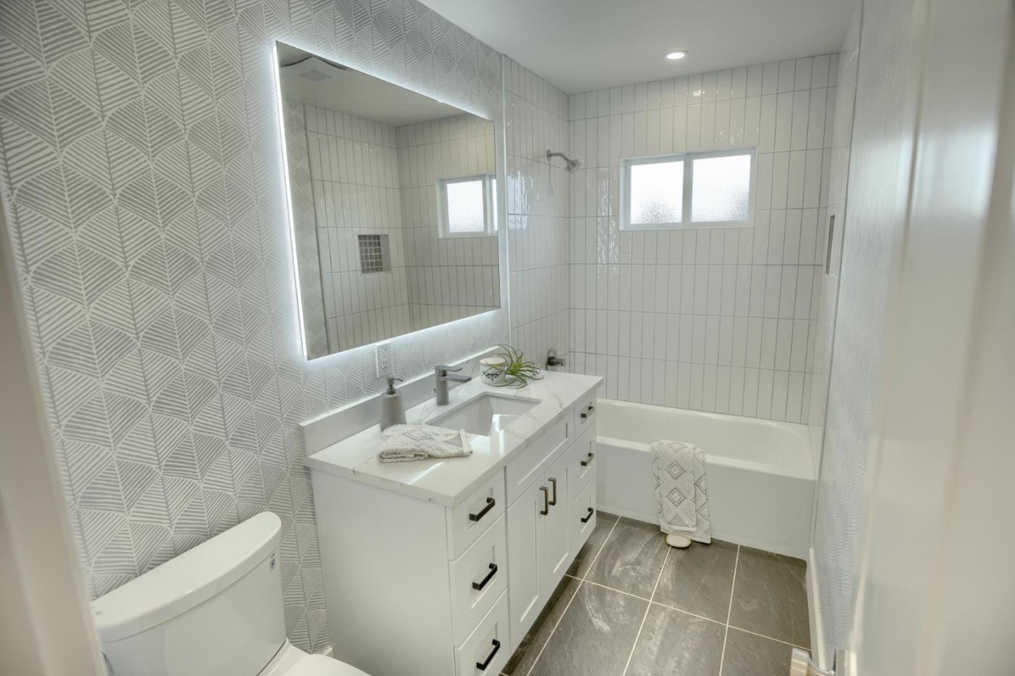 1003 Rosa Avenue Sunnyvale, CA 94086 - Photo 51 of 60 a bathroom with a bathtub shower sink and toilet