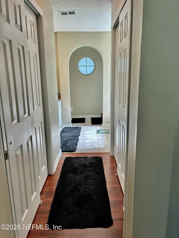 a living room with a large window and a table