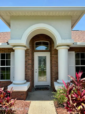 a front view of a house with glass windows