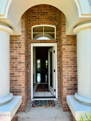 a living room with furniture rug and wooden floor