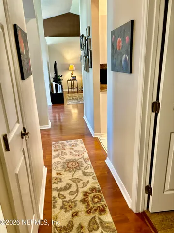 a kitchen with stainless steel appliances granite countertop a refrigerator a stove and a sink