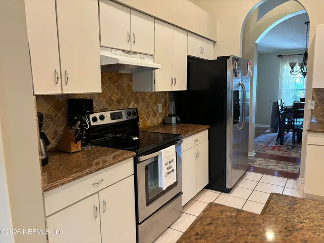 a bath tub sitting next to a window