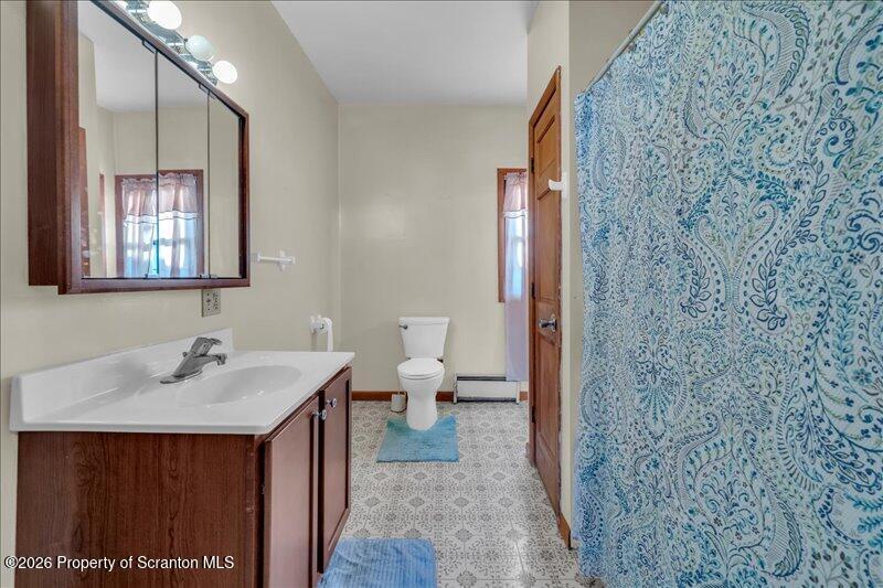 1228 Lake Road Factoryville, PA 18419 - Photo 22 of 43 a en suite bathroom with a sink and a toilet