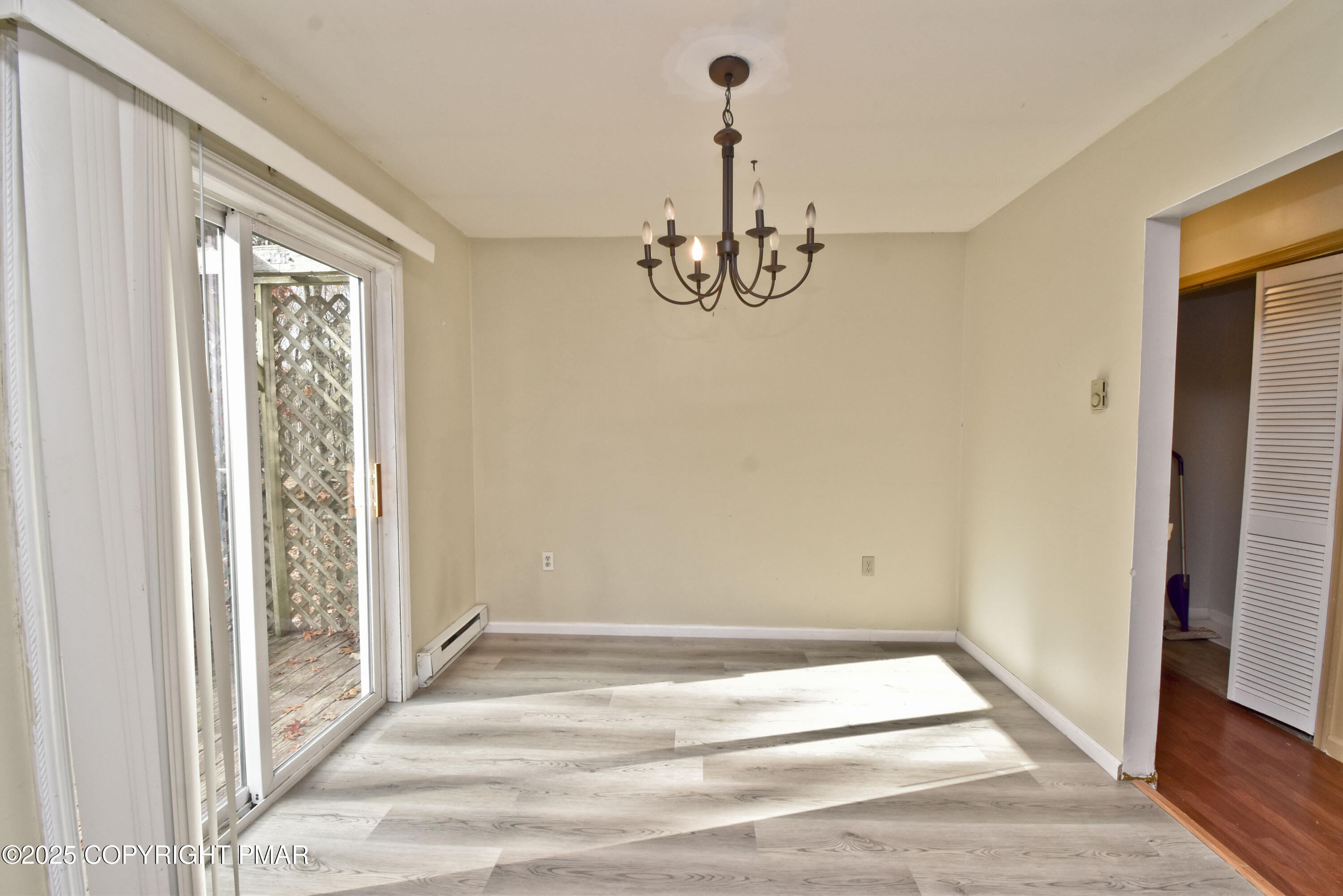 3282 Bluebird Drive Bushkill, PA 18324 - Photo 11 of 36 a view of empty room with wooden floor and window