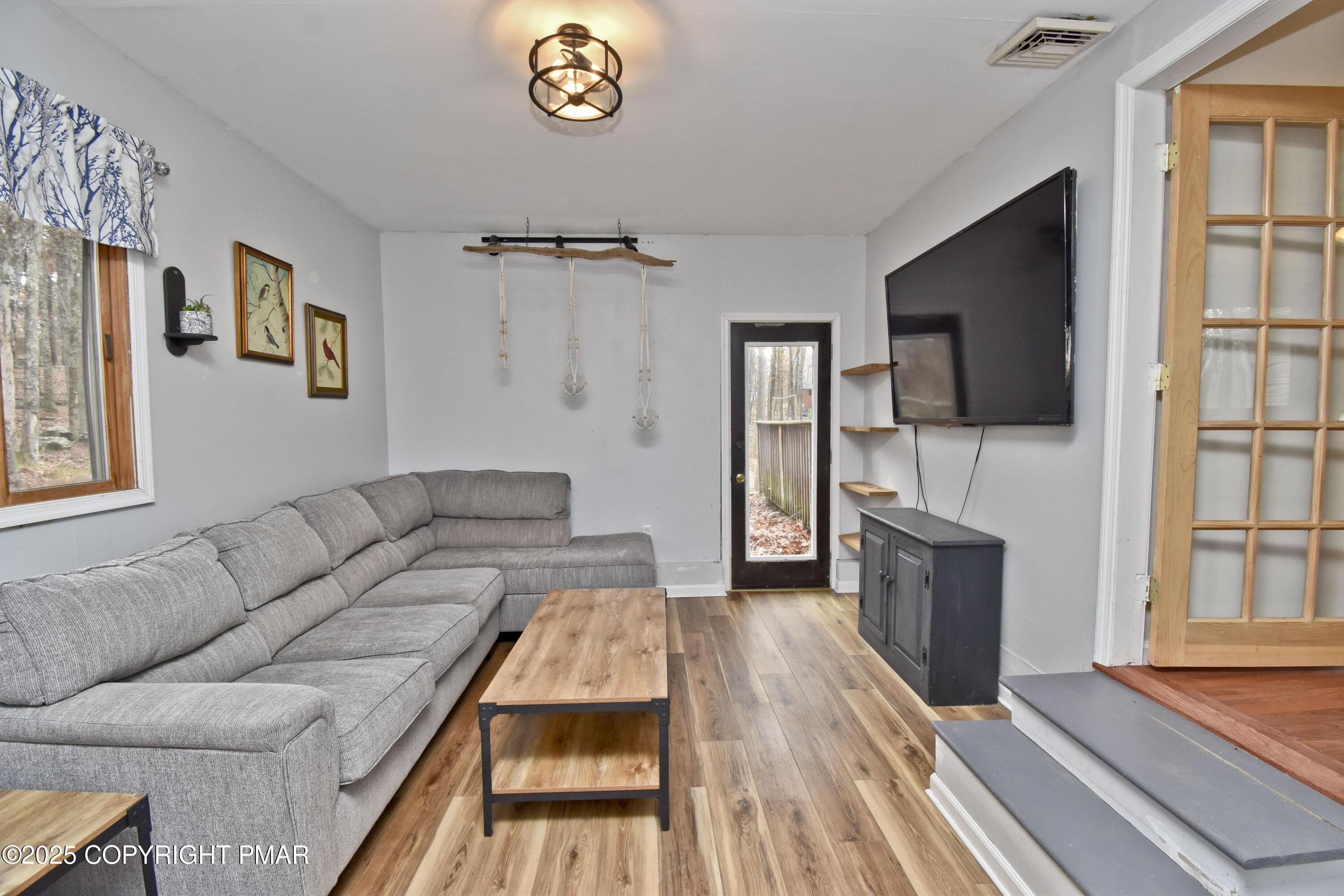 3282 Bluebird Drive Bushkill, PA 18324 - Photo 14 of 36 a living room with furniture and a flat screen tv
