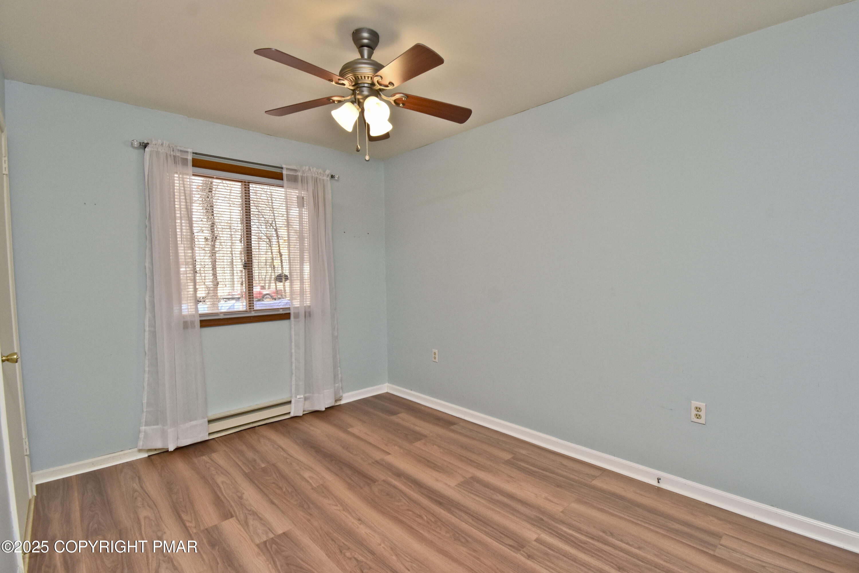 3282 Bluebird Drive Bushkill, PA 18324 - Photo 21 of 36 wooden floor in an empty room with a window