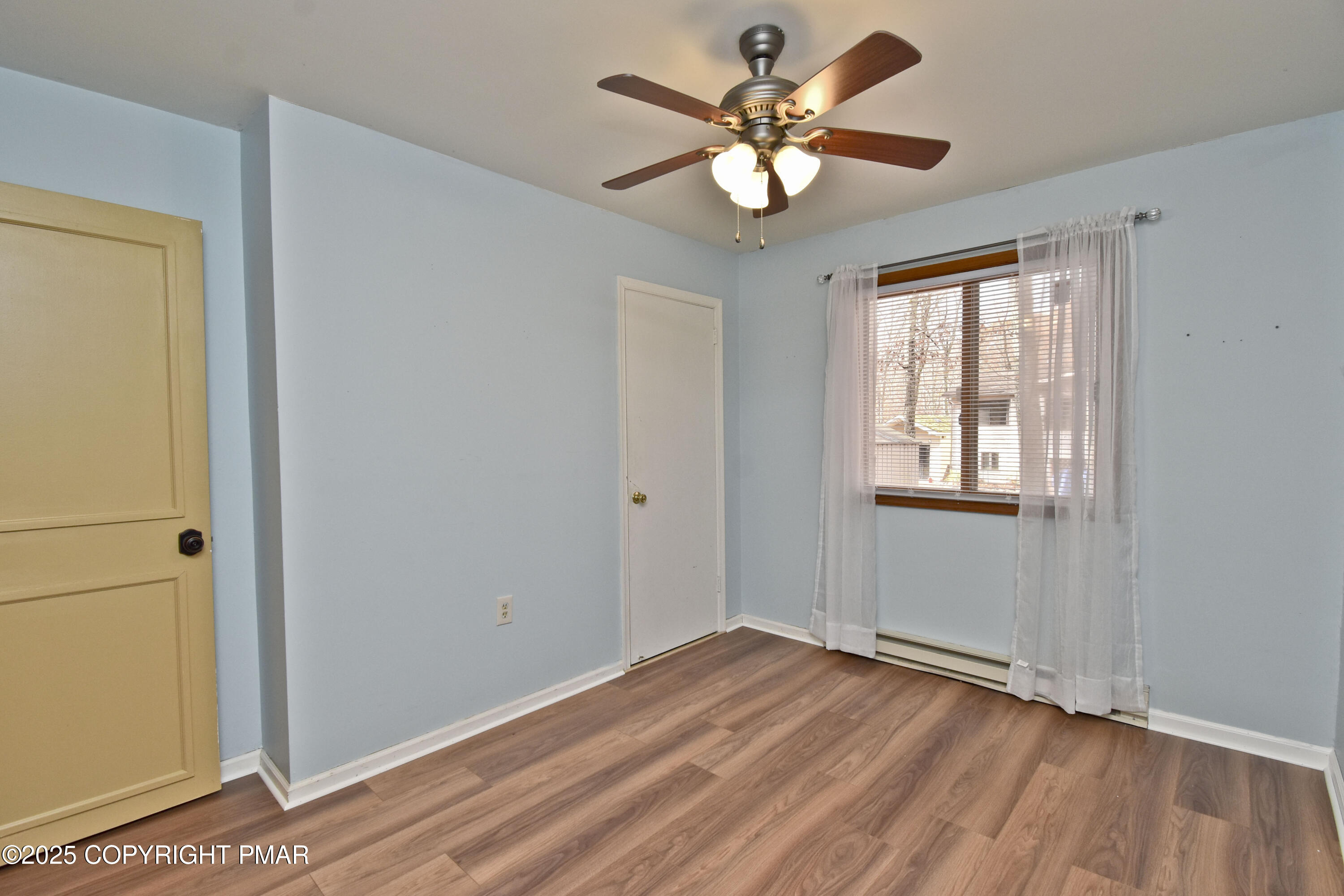 3282 Bluebird Drive Bushkill, PA 18324 - Photo 22 of 36 a view of an empty room with wooden floor and a window