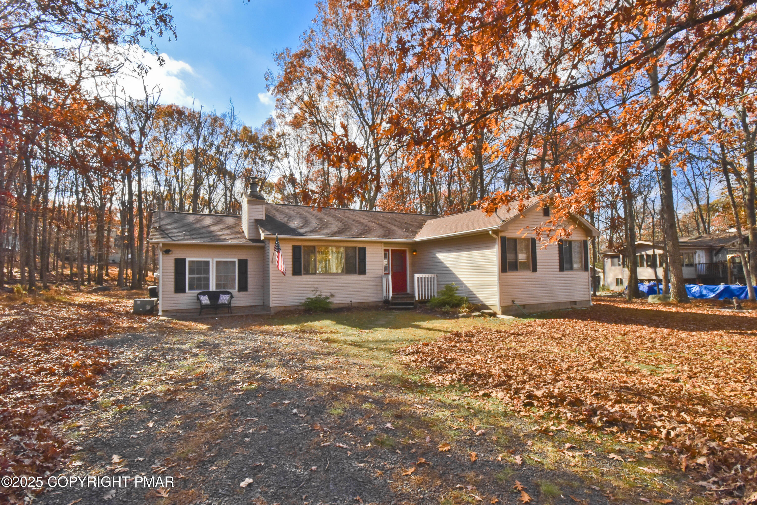 3282 Bluebird Drive Bushkill, PA 18324 - Photo 31 of 36 a tree in front of a white house
