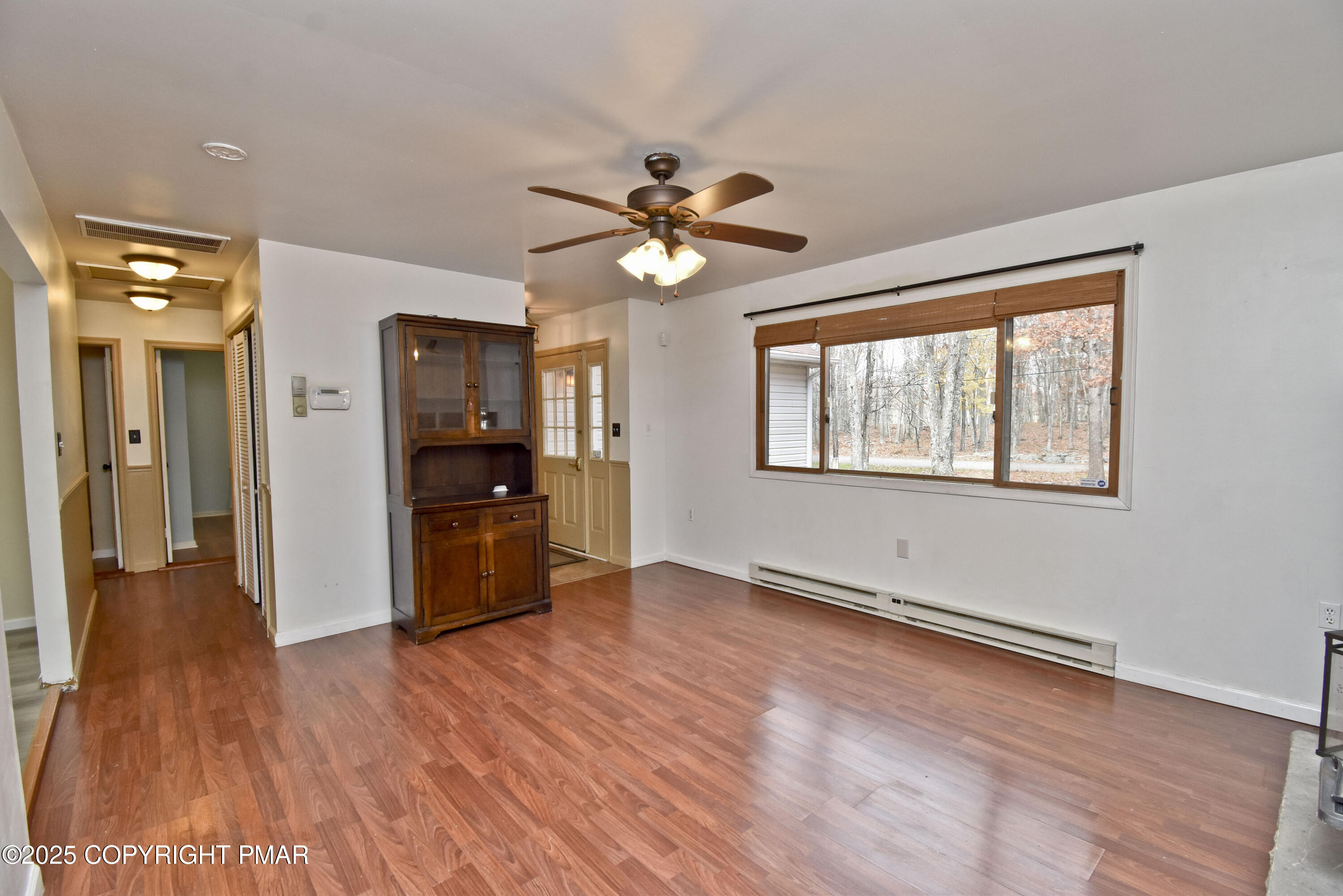 3282 Bluebird Drive Bushkill, PA 18324 - Photo 4 of 36 a view of an empty room with window and wooden floor