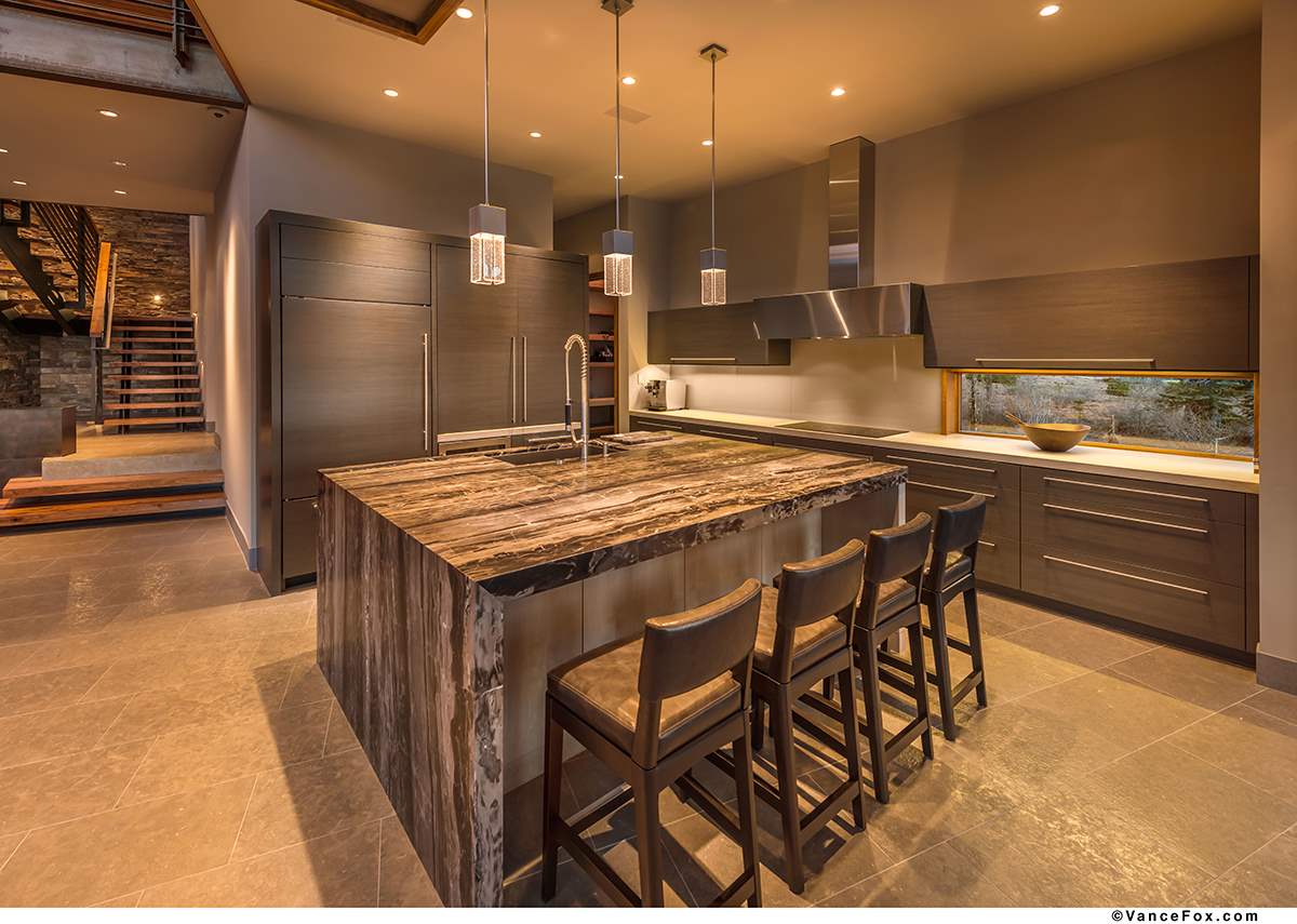 10507 Kaweah Circle Truckee, CA 96161 - Photo 9 of 10 a kitchen with stainless steel appliances kitchen island granite countertop a table chairs sink and cabinets