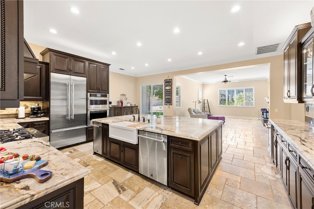 5810 Etiwanda Avenue Rancho Cucamonga, CA 91739 - Photo 13 of 68 a kitchen with stainless steel appliances granite countertop a sink stove and refrigerator