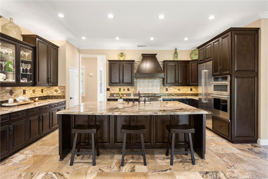 5810 Etiwanda Avenue Rancho Cucamonga, CA 91739 - Photo 17 of 68 a kitchen with stainless steel appliances a sink and a refrigerator
