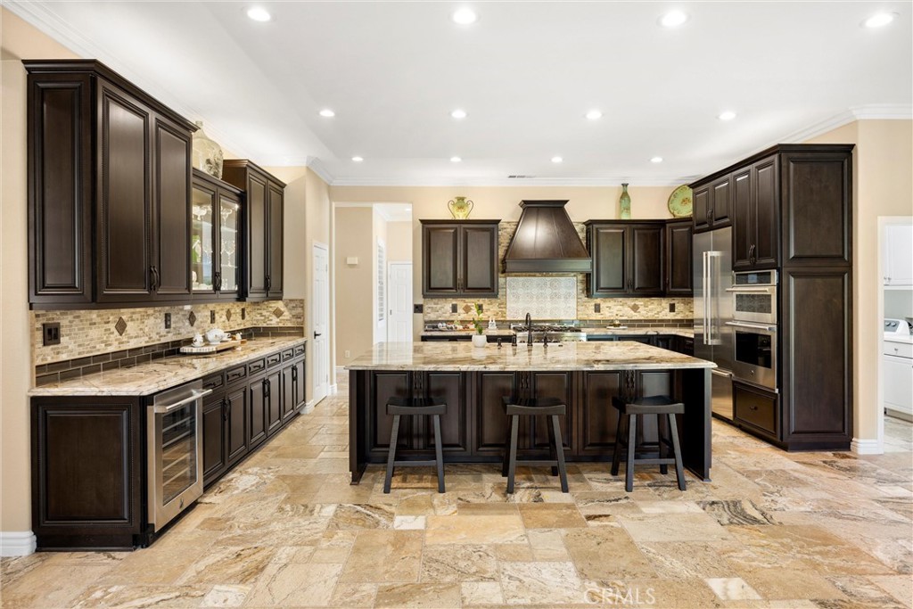 5810 Etiwanda Avenue Rancho Cucamonga, CA 91739 - Photo 20 of 68 a large kitchen with kitchen island a sink and a stove