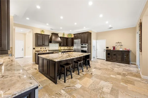 a spacious bathroom with a granite countertop tub sink shower and mirror
