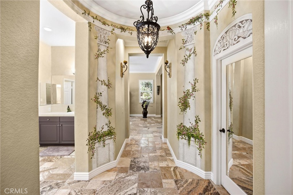 5810 Etiwanda Avenue Rancho Cucamonga, CA 91739 - Photo 22 of 68 a view of a hallway with wooden floor and front door