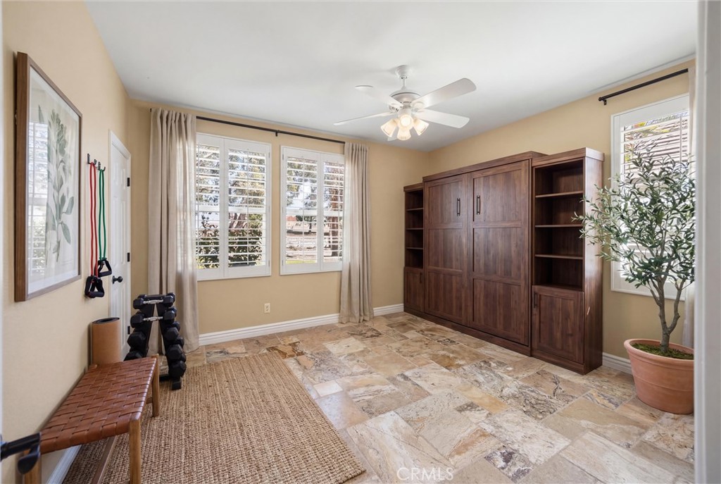 5810 Etiwanda Avenue Rancho Cucamonga, CA 91739 - Photo 32 of 68 a view of an empty room with a window and wooden floor