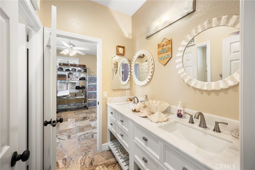 5810 Etiwanda Avenue Rancho Cucamonga, CA 91739 - Photo 33 of 68 a bathroom with a double vanity sink mirror and shower