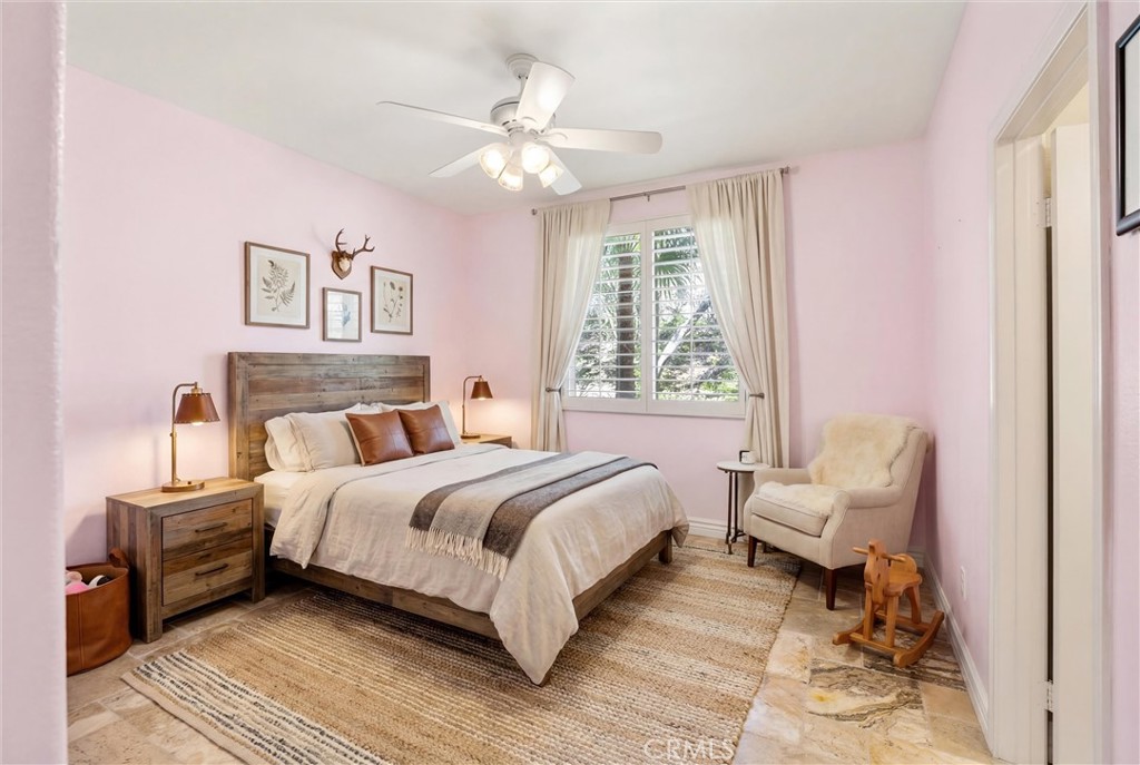 5810 Etiwanda Avenue Rancho Cucamonga, CA 91739 - Photo 36 of 68 a bedroom with a bed and a chandelier