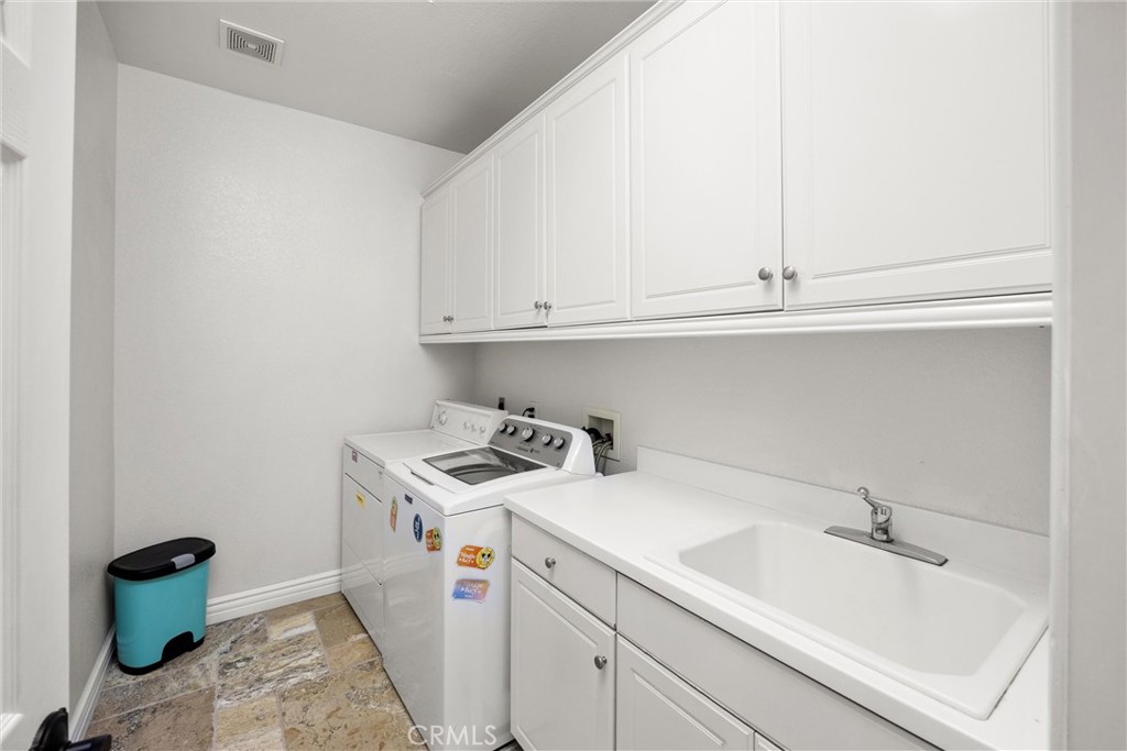 5810 Etiwanda Avenue Rancho Cucamonga, CA 91739 - Photo 38 of 68 a utility room with dryer and washer