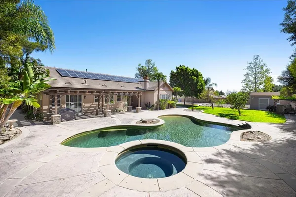 a view of yard in front of house with a yard