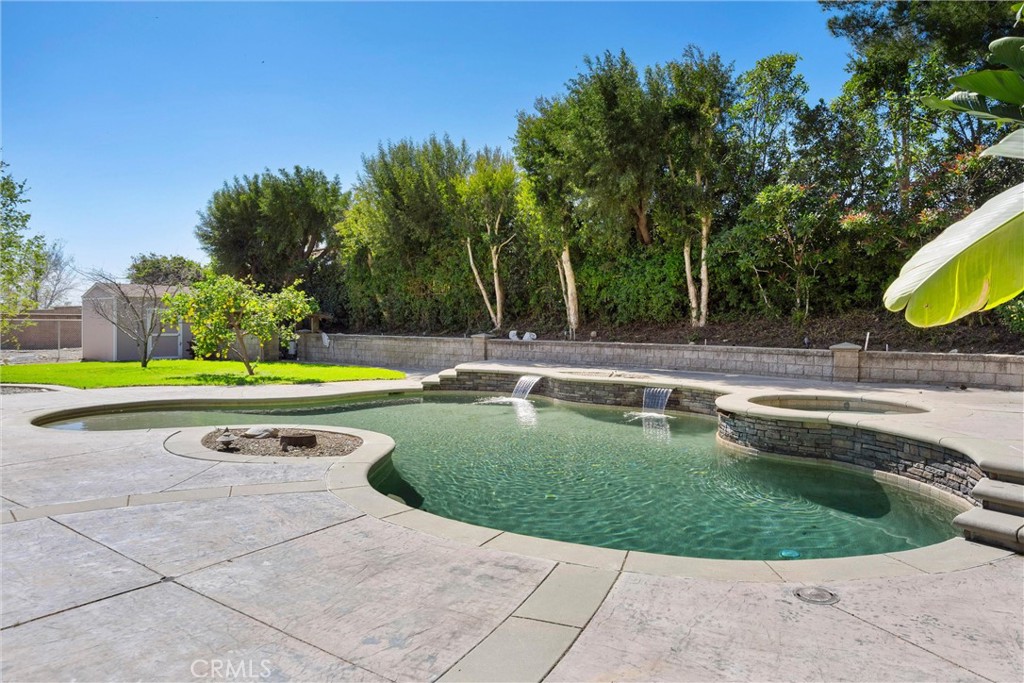 5810 Etiwanda Avenue Rancho Cucamonga, CA 91739 - Photo 45 of 68 a view of a swimming pool and a yard