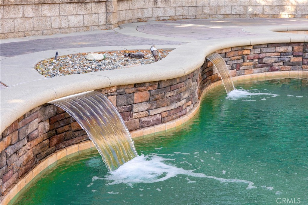 5810 Etiwanda Avenue Rancho Cucamonga, CA 91739 - Photo 47 of 68 a view of a swimming pool with a garden