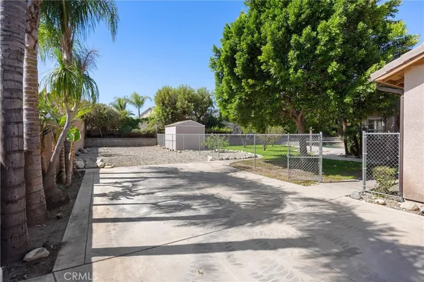 a view of a house with a yard and garden