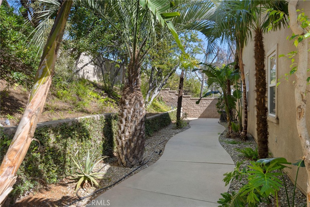 5810 Etiwanda Avenue Rancho Cucamonga, CA 91739 - Photo 56 of 68 a view of a pathway both side of a yard