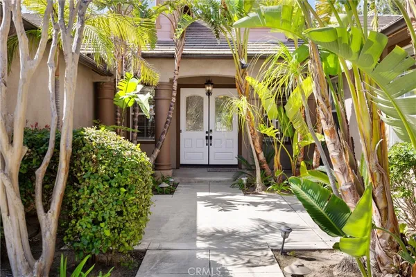 a view of a dining room with furniture large windows and wooden floor