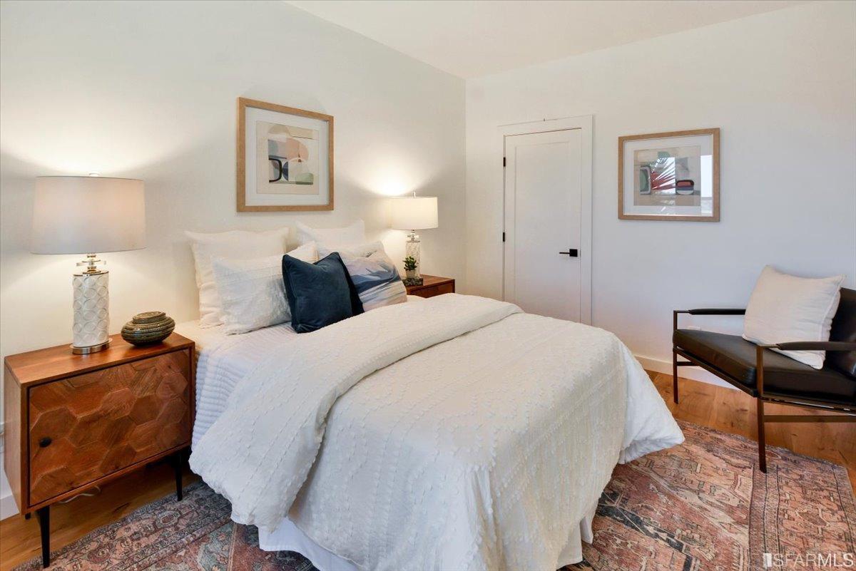 334 Holladay Avenue San Francisco, CA 94110 - Photo 13 of 36 a bedroom with bed and a chair