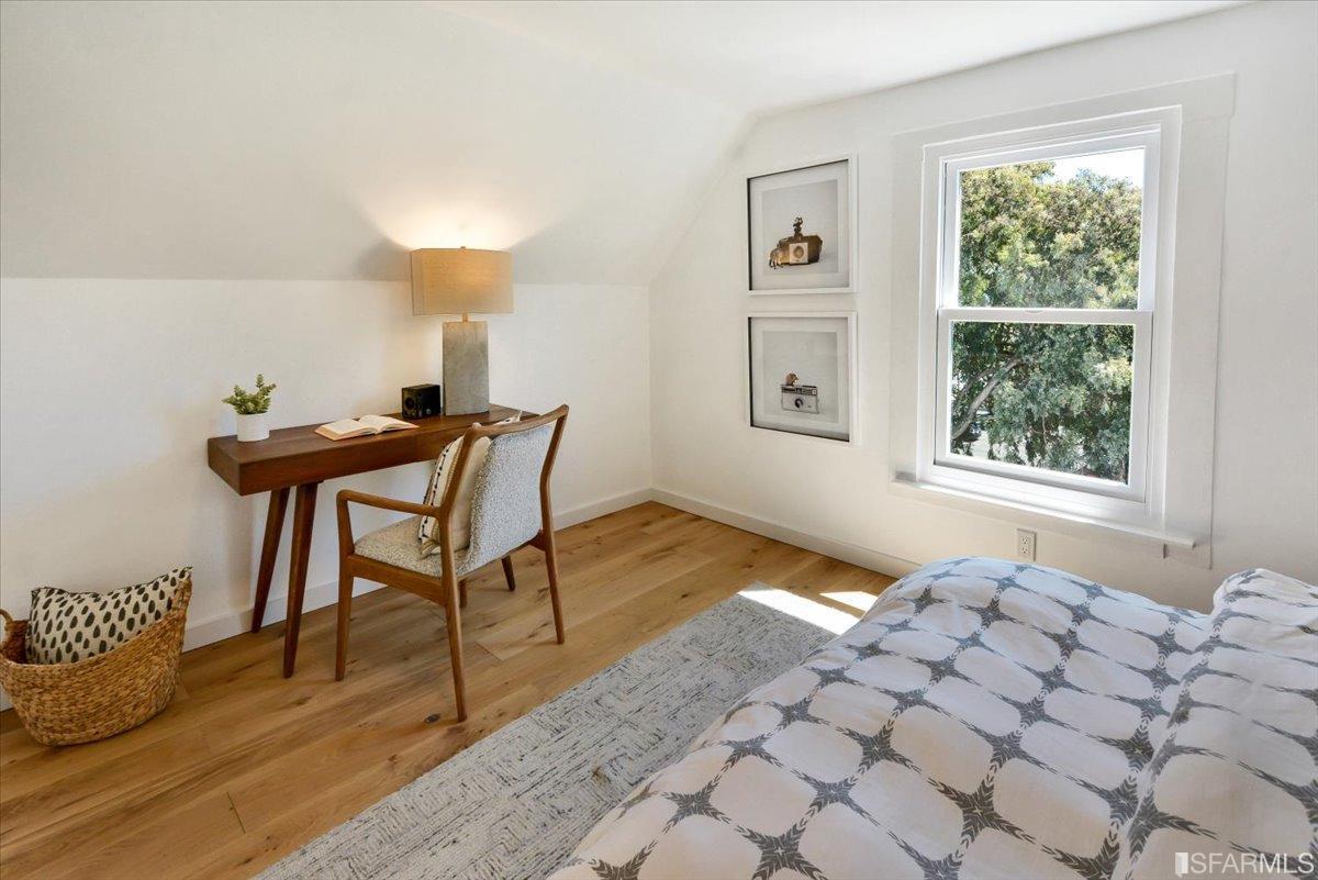 334 Holladay Avenue San Francisco, CA 94110 - Photo 18 of 36 a bedroom with a bed and a window