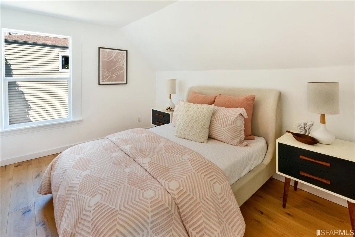 334 Holladay Avenue San Francisco, CA 94110 - Photo 21 of 36 a bedroom with a bed and a desk