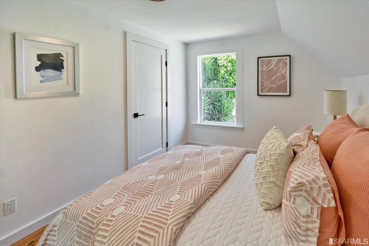 334 Holladay Avenue San Francisco, CA 94110 - Photo 23 of 36 a bed room with a bed and a window