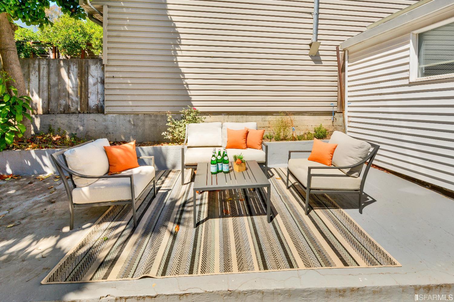 334 Holladay Avenue San Francisco, CA 94110 - Photo 27 of 36 an outdoor sitting area with furniture and wooden floor