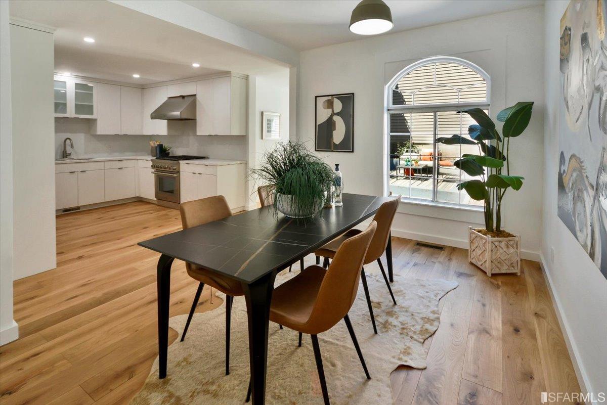 334 Holladay Avenue San Francisco, CA 94110 - Photo 9 of 36 a view of a dining room with furniture and a potted plant